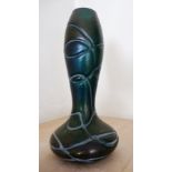 A Loetz style iridescent glass narrow-neck vase with trailed decoration,