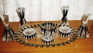 An Art Deco cut and black overlaid nine-piece trinket set