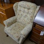 A pair of modern wingbacks in floral fabric