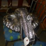A silvered model elephant head