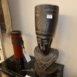 A carved African bust and a quiver