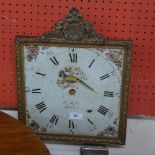 An antique hand painted clock face framed