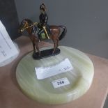 A marble ashtray with bronzed soldier on horse