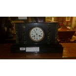 A Victorian slate mantle clock with Arabic numeral dial