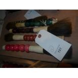 A collection of five Chinese calligraphy brushes