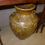 A large highly fired Chinese garden pot decorated with dragons and phoenix