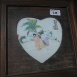 A pair of heart shaped erotic plaques