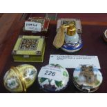 A collection of three enamelled boxes, a cloisonne pill box and porcelain pill box and a porcelain