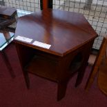 An oak hexagonal two tier book table