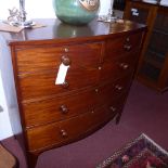 A C19th mahogany bow fronted chest fitted two short and three long drawers with knob handles