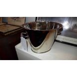 A silver plated twin handled wine cooler of oval form