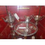 A silver plated Neoclassical inspired tea set consisting of a tea pot, milk jug, and sucrier with