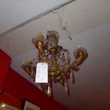 A C19th gilt four branch hanging chandelier with hanging cut glass lustres