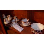 A set of six Sutherland porcelain coffee cups and saucers together with a similar cup, saucer and