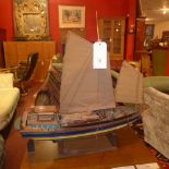 A scale model sailing boat on stand