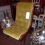 An Edwardian walnut childs slipper chair upholstered in buttoned velour