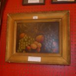 An Edwardian oil on board of fruit signed Reynolds in a gilt frame