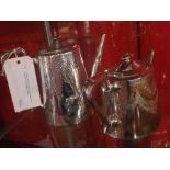 A silver plated four piece tea set with engraved detail and a silver plated coaster