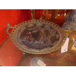 A C19th French gilt metal charger with extensive pierced detail and Oriental scene in relief