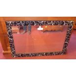 A rectangular Venetian style rectangular wall mirror having a bevelled plate