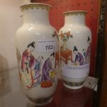 A pair of Chinese hand painted famille rose porcelain vases decorated with figural scenes