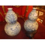 A pair of Chinese blue and white double gourd shaped vase decorated with dragons