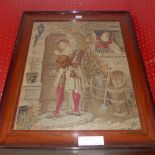 An antique needlework panel of a huntsman beside a cottage glazed and framed