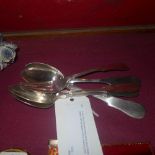 A set of four Russian hallmarked silver fiddle pattern serving spoons with a matching fork