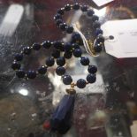 A Lapiz Lazuli facetted beaded necklace and matching earings