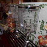 A pair of glass and silver plated table top storm lanterns of large size