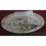 A Chinese Guang Xu oval form dish decorated with geese and foliage