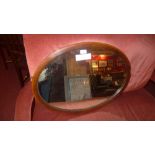 An Edwardian inlaid mahogany mirror with oval plate