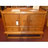 A Heals 1920`s honey oak sideboard fitted arrangement of four drawers and pair of cupboard doors