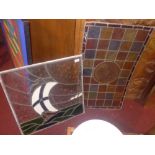 Two stained leaded glass panels one with