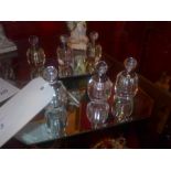 A collection of glass perfume bottles wi