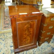 A William IV mahogany cabinet on plinth