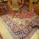 A Persian hand knotted carpet the rouge