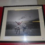 A football memorabilia photograph signed