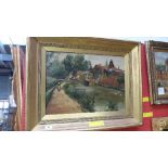 An oil on canvas Dutch canal scene with