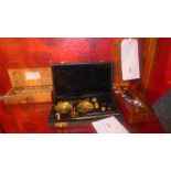Two set of jewellers weighing scales in wooden cases and a set of weights