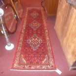 A fine North West Persian Malayer runner 280cm x 80cm triple pole medallion with repeating motifs on