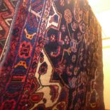 A fine North West Persian Nahawand rug 230cm x 130cm the central pendant medallion on a sapphire