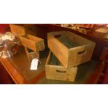 A collection of six stained pine vegetable boxes of different size