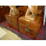 A pair of Chinese hardwood bedside cabinet with drawers and cupboards