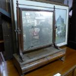 A William IV flame mahogany dressing mirror the swing plate above two drawers