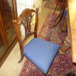 A set of four late Victorian mahogany carved back dining chairs with blue wrapover seats