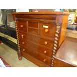 A Victorian mahogany Scottish chest having an arrangement of drawers on turned feet