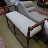 A mahogany window seat with ivory damask on fluted support