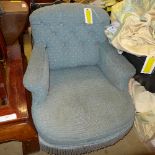 A Victorian mahogany armchair upholstered in blue button fabric
