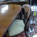A set of four Victorian style mahogany dining chairs with wrapover seats on reeded supports